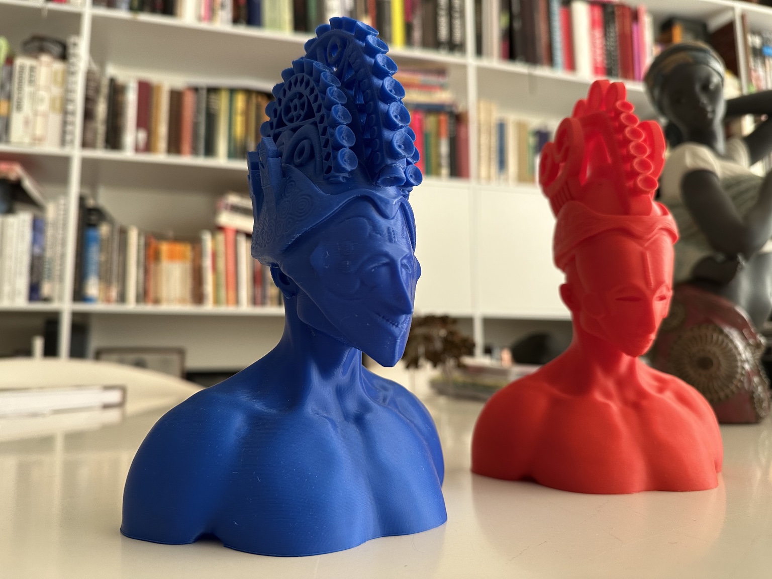 Detail of a blue contemporary 3D printed mask-inspired figure