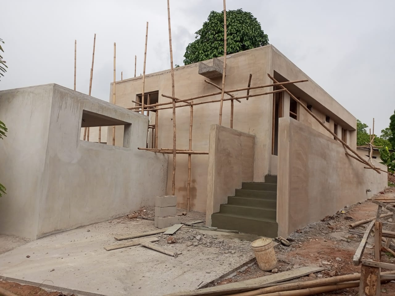 Okpara House concrete form under construction with bamboo scaffolding