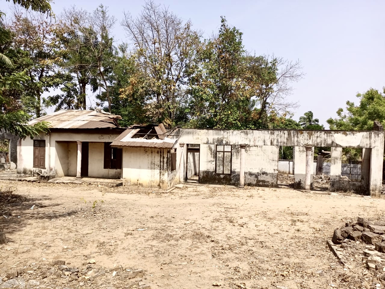 Remains of the inherited building after the fire and during clearing