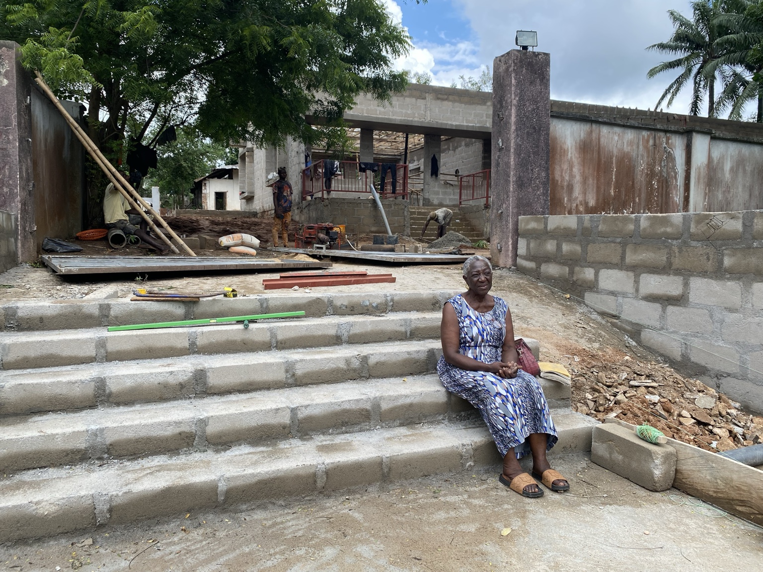 Dame Adeline U. Nwazota seated at the Okpara House construction site