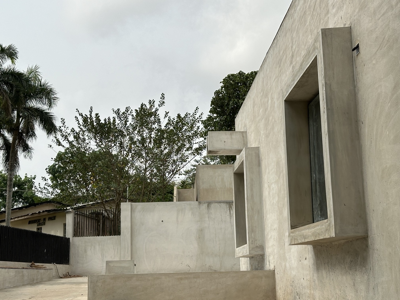 Projecting concrete window frames along Okpara House
